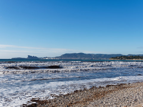 View on Mediterranean sea, shores, calanques and waterfront of La Ciotat, eagle's beak, calanque du Mugel from Sandy beach at Les Lecques, Saint-Cyr-sur-Mer in French Riviera