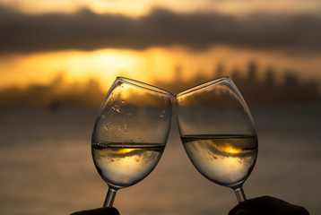 Clinking glasses at sunset,Sydney Australia 