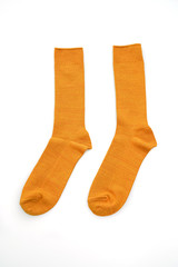 yellow mustard socks on white background