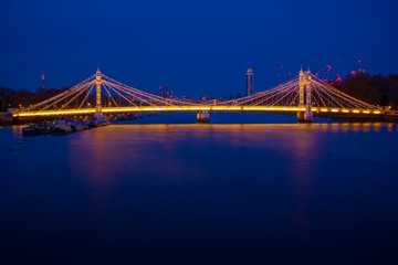 Long exposure, illuminated Albert bridge in London at night