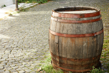Fototapeta premium old wine barrel on the paving stones
