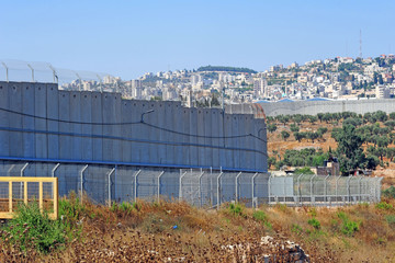 SEPARATION WALL NEAR BETHLEHEM, ISRAEL, January 2020. Border separation Wall Shimmering In Heat,...