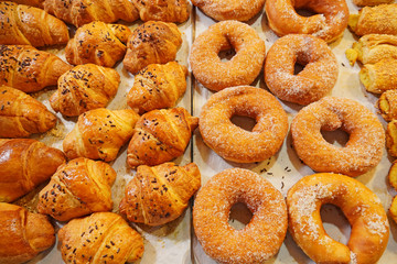 Fresh baked french croissants in a bakery, close up in old city market Jerusalem                  