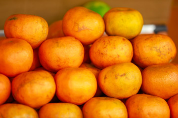 Fresh orange bunch in fruit stall 