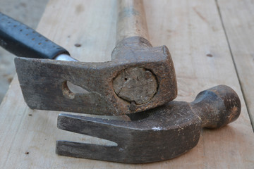 old construction of a house and repair tools on wooden background