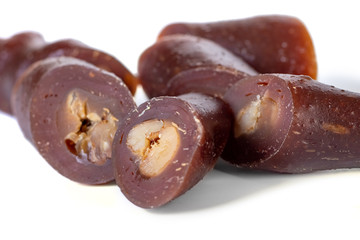 Georgian homemade churchkhela with walnuts and grape juice isolated on white