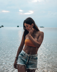 Beautiful girl enjoying a sunny day at the beach