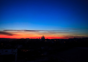 Night black silhouette of cityscape Kamianets-Podilskyi in Ukraine