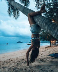 Girl playing on Swing at thailand beach in Koh Tao