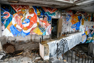 Wall mural in Palace of Culture in abandoned city of Prypiat, near Chernobyl nuclear power plant, Ukraine. December 2019