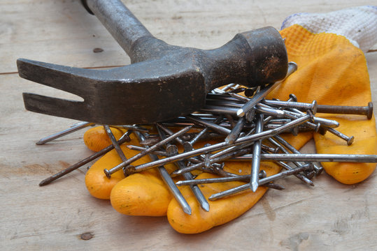 old construction of a house and repair tools on wooden background