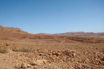 Drought land desert arid landscape against clear blue sky