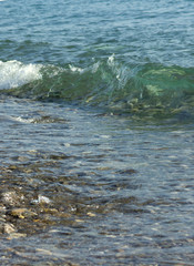 sea waves with azure white foam spin in lamb shingle beach