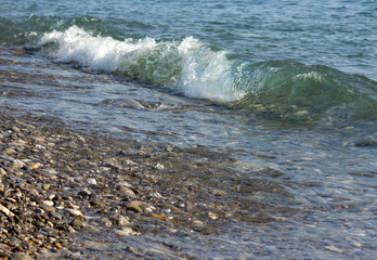 sea waves with azure white foam spin in lamb shingle beach