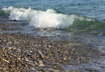 sea waves with azure white foam spin in lamb shingle beach