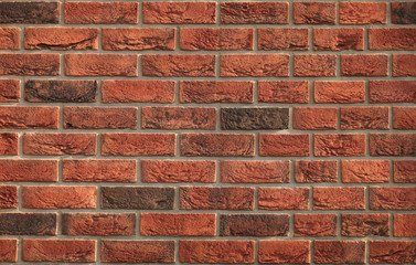 Decorative wall texture, background. Rusty, matted, red bricks. The fragment of a new stylish...