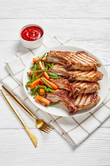 Grilled pork loin cutlets on a plate