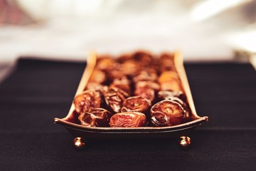 Beautiful bowl full of date fruits.