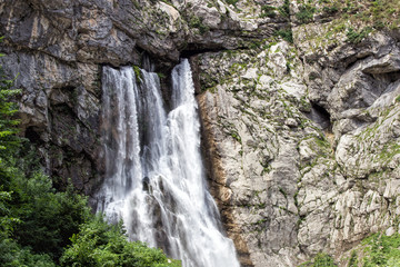 Fototapeta na wymiar Gegsky waterfall in the forest. Abkhazia