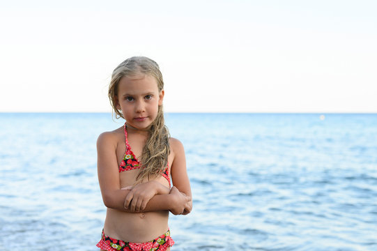 six years old little girl having fun at summer vacation in sea
