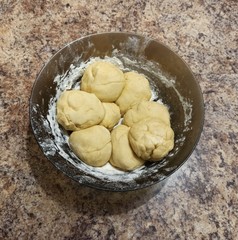 dough balls in bowl on table