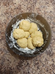 dough balls in bowl on table