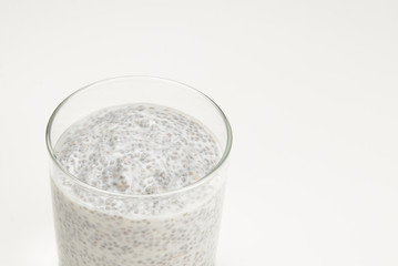 Chia pudding  in glass on a white background. Space for text or design.