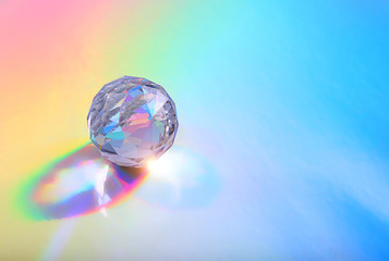 Crystal prism Refracting light in vivid rainbow colors. Refractions of light in glass prism. glass...