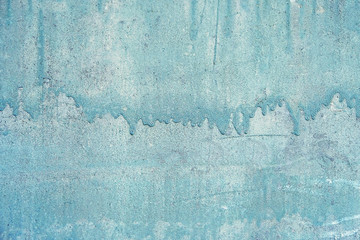 Fototapeta premium abstract blue painted wall. Texture of old rustic wall covered with blue-grey paint. background texture grunge painted. background for web design and wallpaper. close up. 