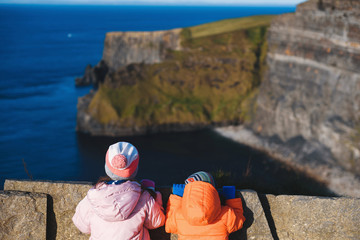 boy and girl looking at cliff of moher