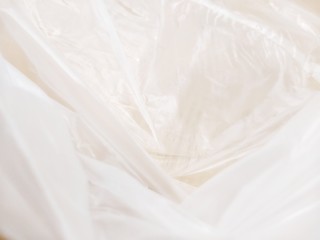 Inside a white plastic bag on an abstract background