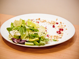 plates with salad on a table decorated with dressing dressing