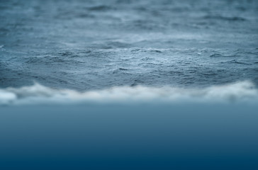 Fototapeta na wymiar Waves at sea. Low angle shooting. Selective focus.