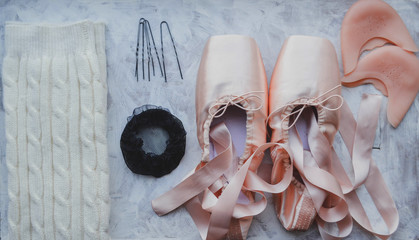 Ballerina things. Pointe shoes, knitted gaiters, hairpins, hair net, ballet silicone pad