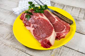 raw beef ribeye on a plate