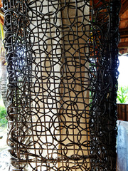 Black woven rattan as standing lampshade