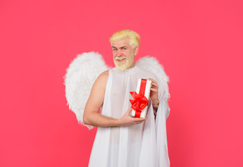February 14. Cupid with gift box. Valentine angel. Cupid angel with present box. Happy Valentines...