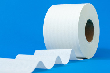 a roll of white toilet paper on a blue background