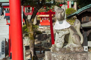 Inari Fox statue at the entrance to the Sankou Inari Shrine at Inuyama Castle, Aichi Prefecture, Japan. Inari is a popular Japanese deity associated with foxes and is s