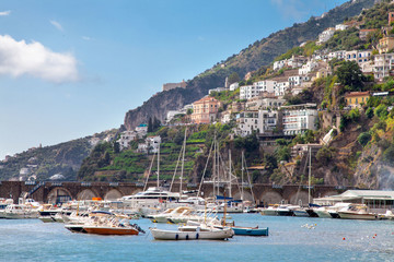 Fototapeta na wymiar Amalfi Coast from below viewing Sorrento mountains along the harbour