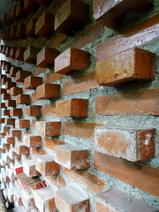 Wall made of red brick wall with unique composition