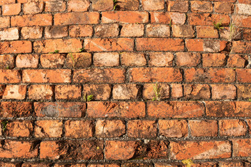 Old brick background. Weathered Stained brick Chimney