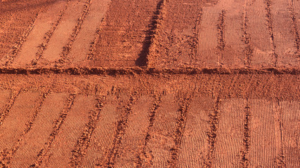View of clay tennis court in winter season. Red tennis court. Ground tennis court. Background. Empty space for text.