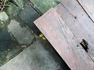 Wood plank and gray natural stone as landscape surface finishing material