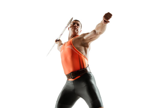 Male athlete practicing in throwing javelin isolated on white studio background. Professional sportsman training in motion, action. Concept of healthy lifestyle, movement, activity. Copyspace.