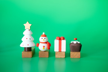 Christmas decorative toys on green background