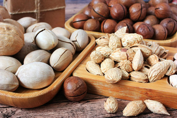 Mix of nuts on wooden plates