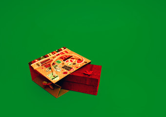 Gift for Valentine's Day. Christmas present. Gift wrap tied with ribbon in a paper bag on a green background.