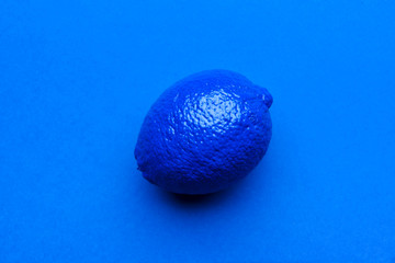 Painted blue lime on color background