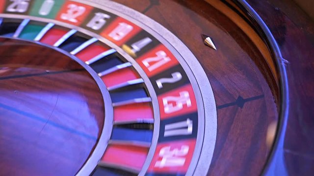 Roulette wheel running in a casino, Poker Chips.Classic casino roulette wheel